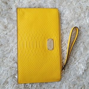 Michael Kors zip clutch with embossed leather.